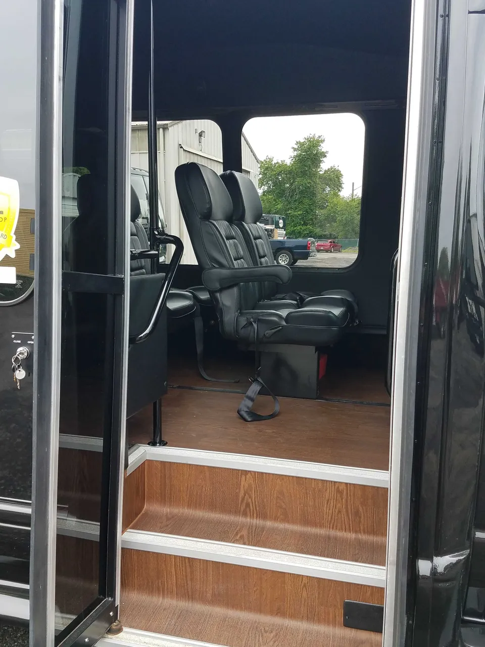 13 Passenger Mini Van interior with wood-look flooring for minibus rental