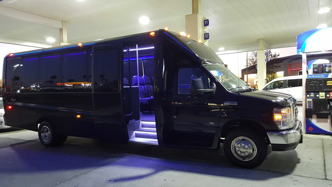 31 Passenger Mini Coach Black 31 Passenger Mini Coach with tinted windows and LED accent lighting for minibus rental