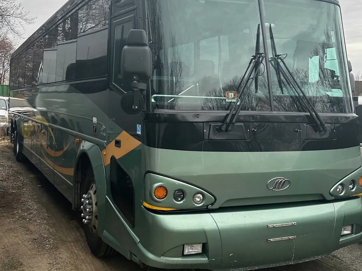 55 Passenger Motor Coach in green, available to rent