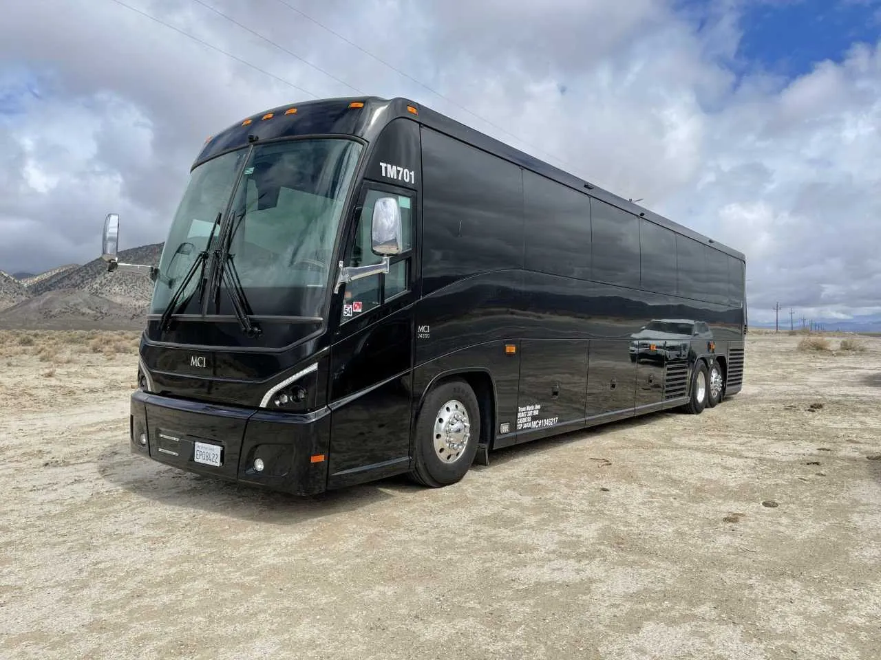 Black 56 Passenger Motorcoach with tinted windows for charter bus rental