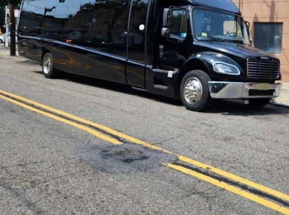 40 Passenger Motorcoach in black, available to rent
