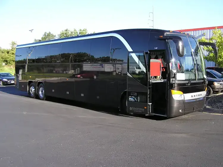 Black 40 Passenger Motorcoach with tinted windows for charter bus rental