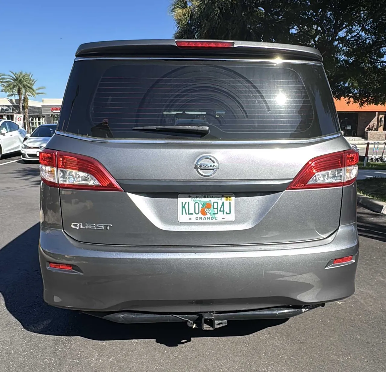 Gray Nissan Quest exterior for minibus rental