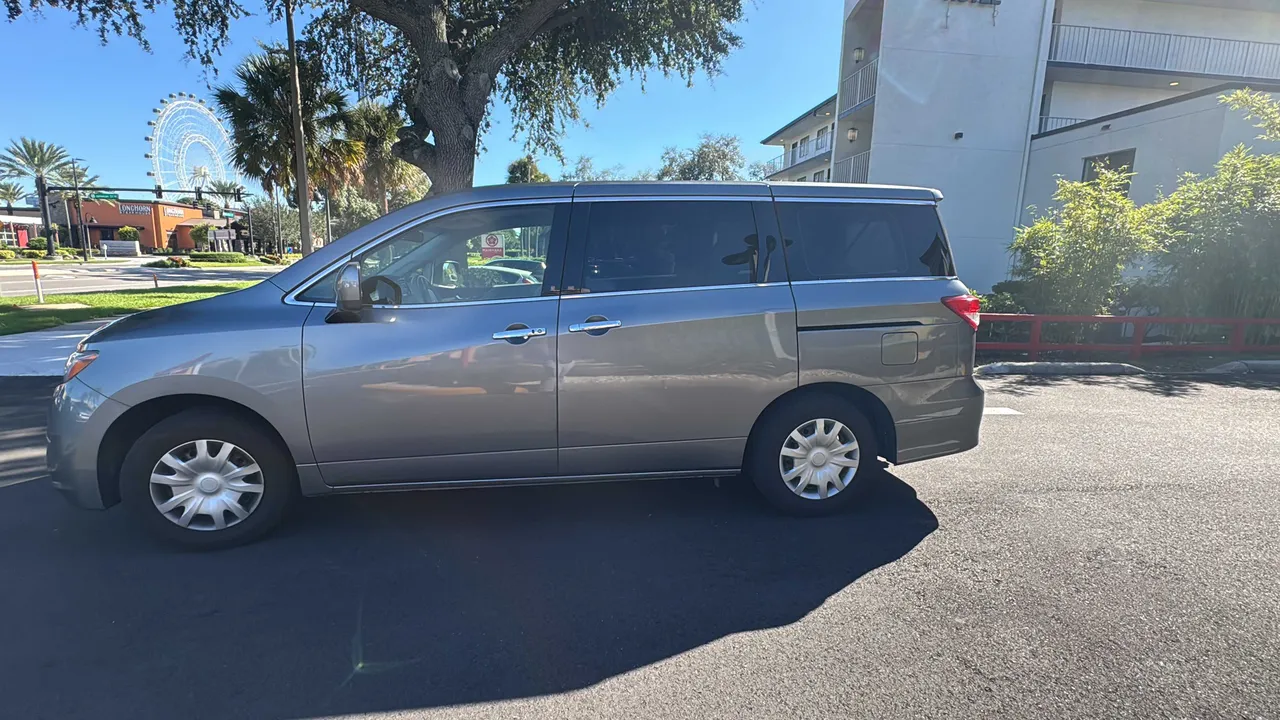 Gray Nissan Quest for minibus rental