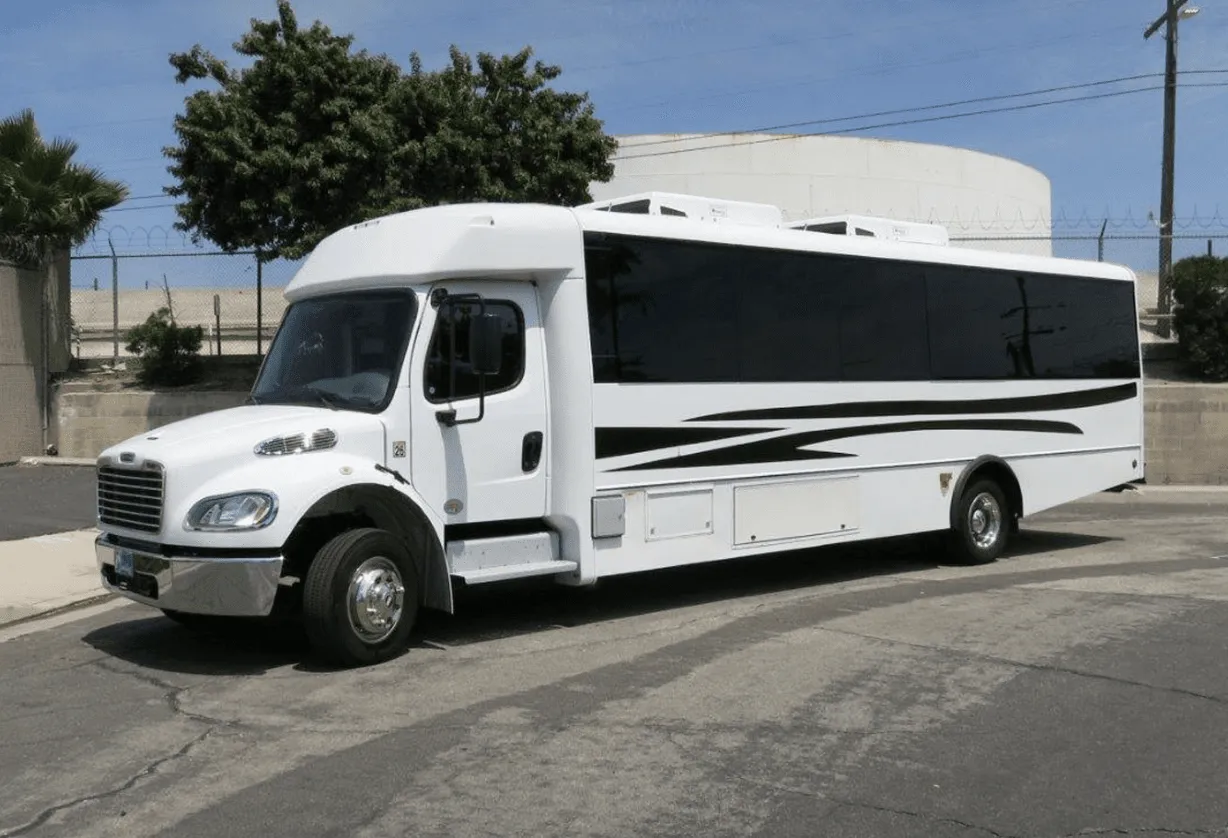 White 26 Passenger Party Bus exterior with tinted windows for party bus rental