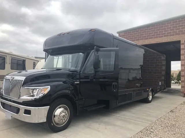 28 Passenger Party Bus in black, available to rent