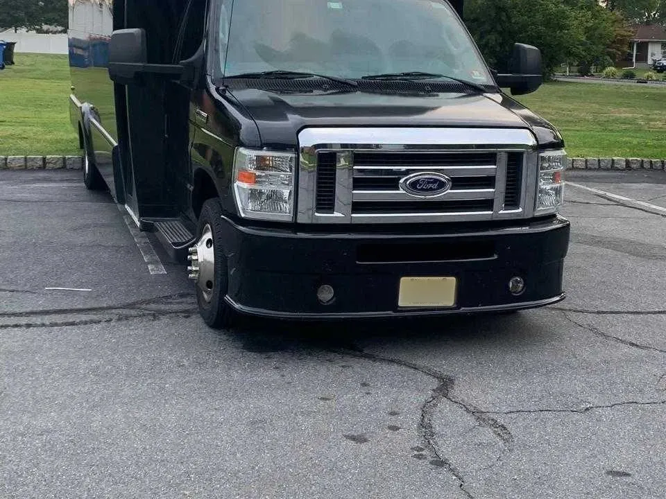 25 Passenger Party Bus in black, available to rent