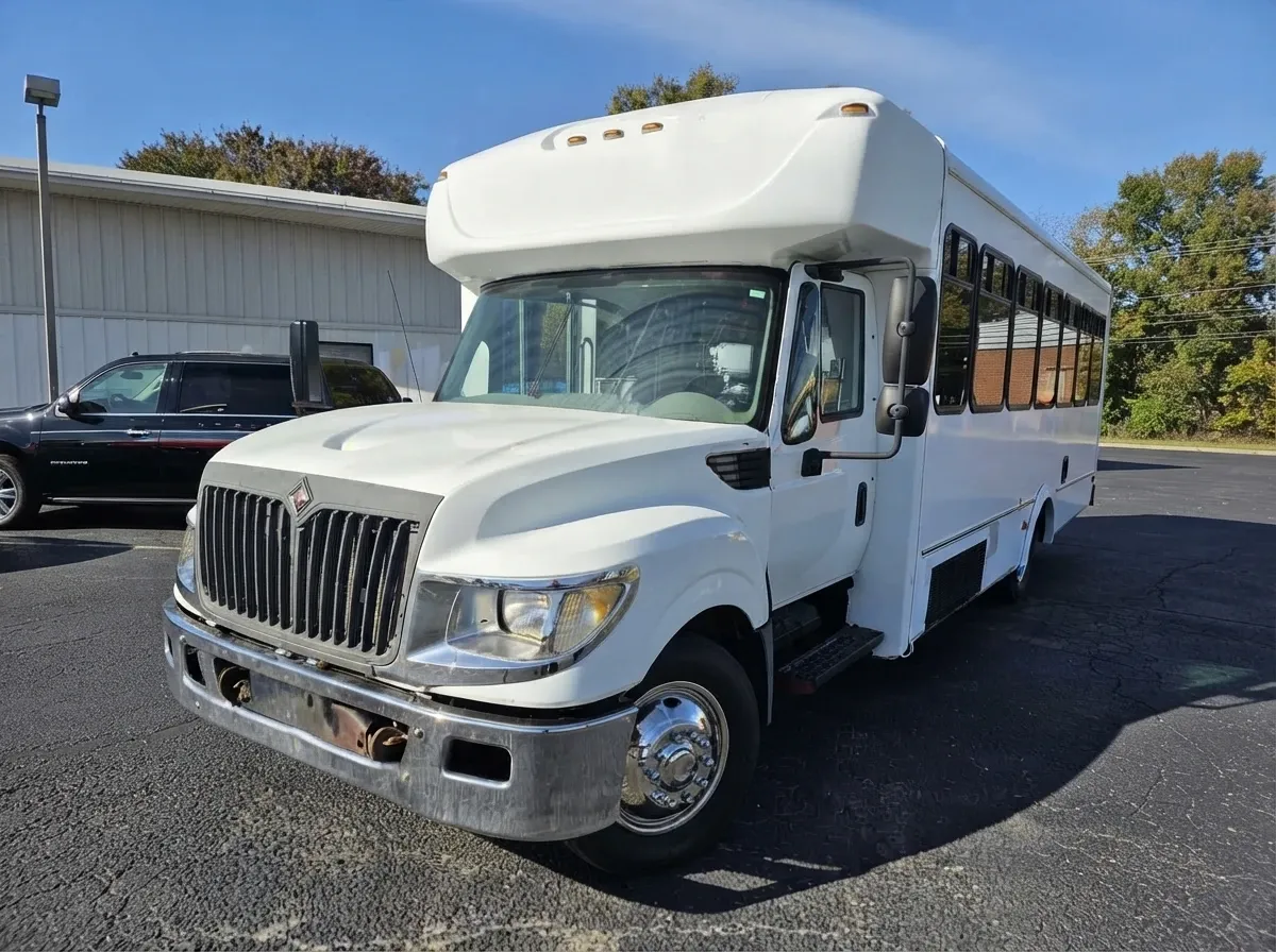 18 Passenger Party Bus in white, available to rent
