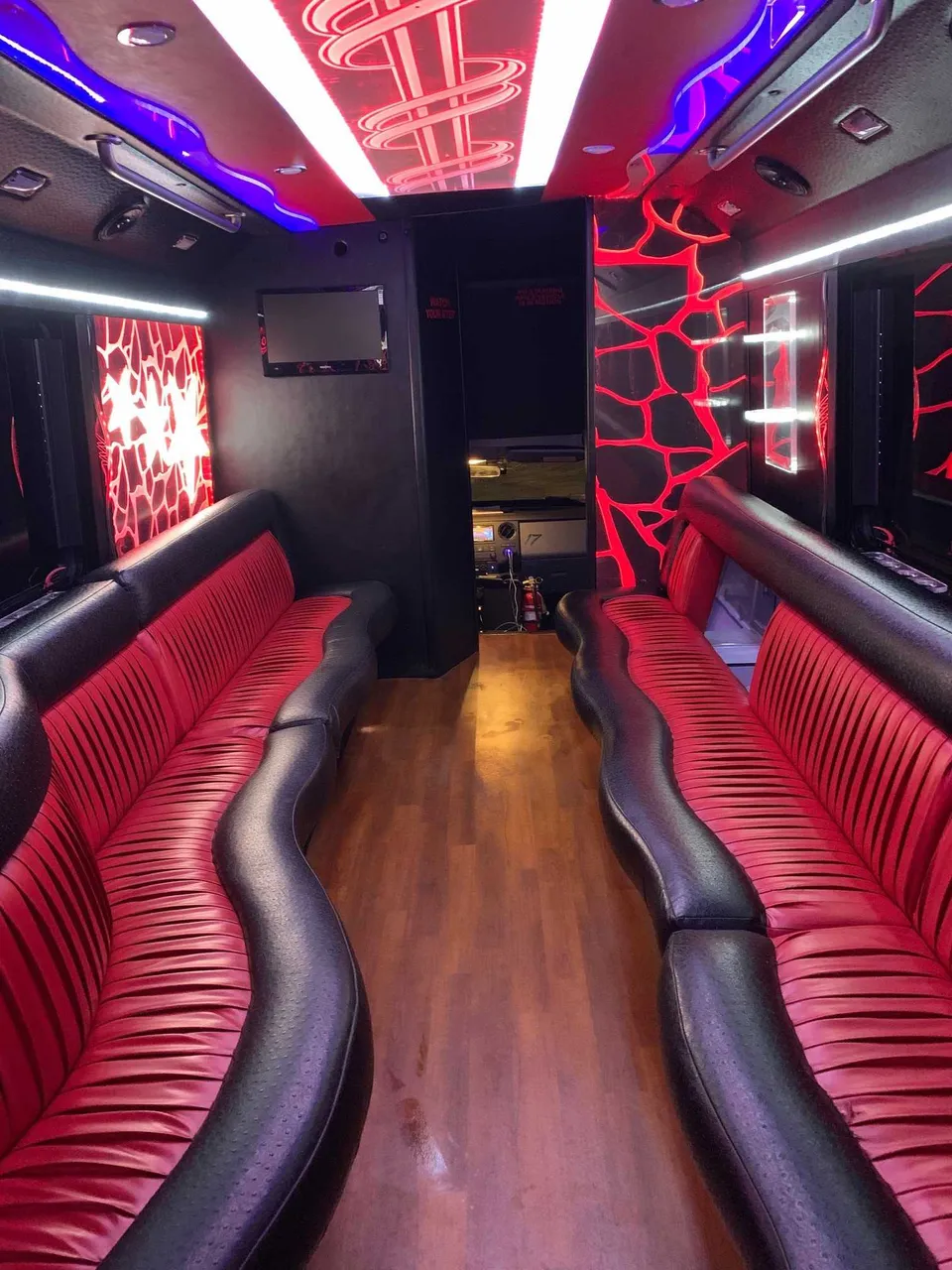 Party Bus - Frank SInatra interior with perimeter lounge seating, LED accent lighting and LED ceiling lighting, photo 2 for party bus rental