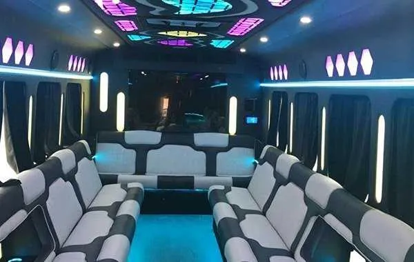 Party Bus White Party Bus White – seating, perimeter lounge seating, window shades and LED accent lighting