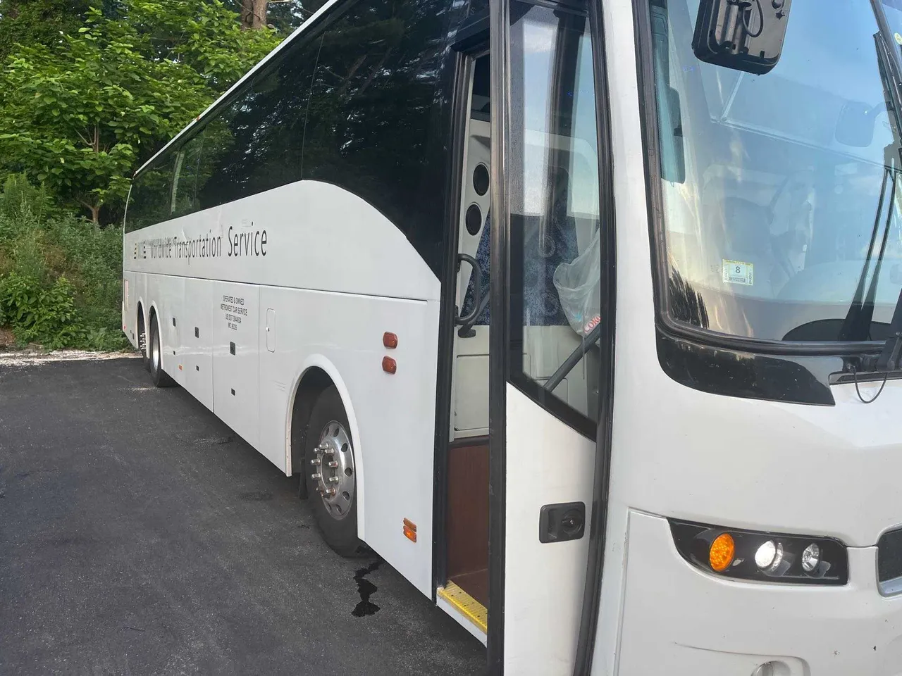 White Volvo Motor Coach for charter bus rental in West Enfield, ME