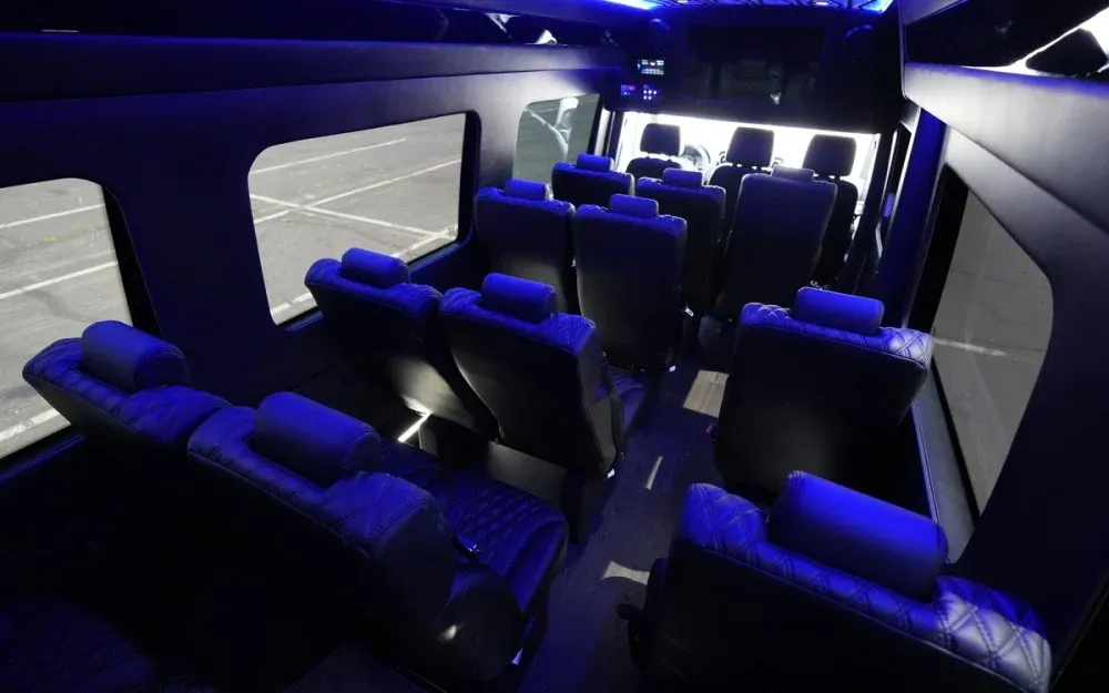 White Luxury Sprinter Shuttle Van interior with LED accent lighting for minibus rental